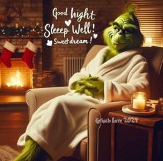 the grin face is sitting in a chair with his arms crossed and legs wrapped up