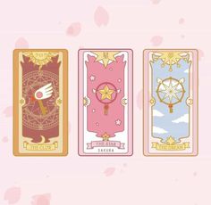 three tarot cards with different designs on them, one is pink and the other has gold