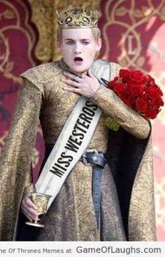 a woman in a gold dress holding a rose and wearing a crown with words on it