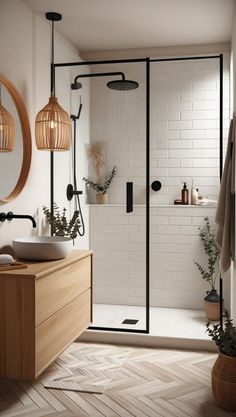 a bathroom with a shower, sink and mirror