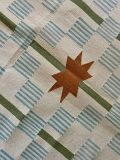 an image of a quilt with a star on it