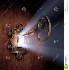 an old key on a wooden door with light coming from it stock photo - image