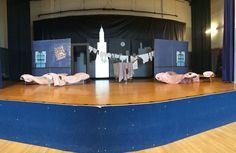 an empty stage with clothes on the floor