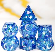 a blue and white set of dices with stars on them