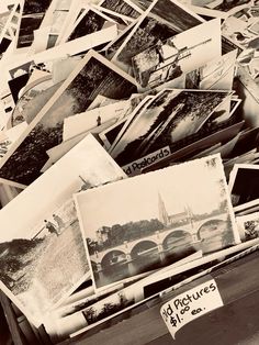 an old suitcase is full of pictures and postcards