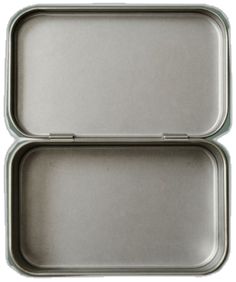 two metal trays sitting next to each other