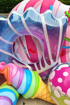 several inflatable toys are laying on the ground