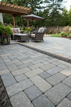 an outdoor patio with chairs, tables and umbrellas