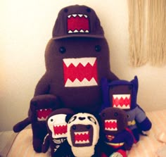 stuffed toys are arranged on a bed