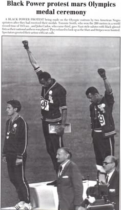 an old newspaper article with two men on the sidelines and one man holding up his fist