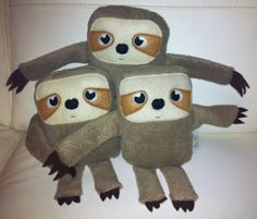 three slotty stuffed animals sitting on top of each other
