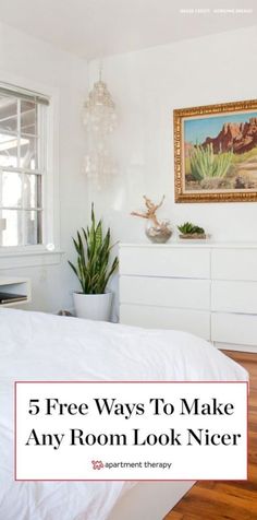 a bedroom with white walls and wood floors is featured in the article 5 free ways to make any room look nicer