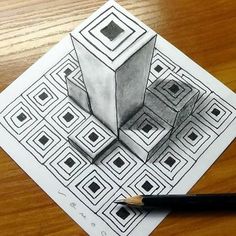 a pencil drawing of a cube on top of a table next to a black pen