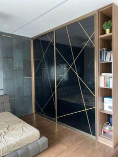 a room with a bed, bookshelf and shelves