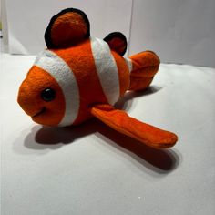 an orange and white clown fish stuffed animal