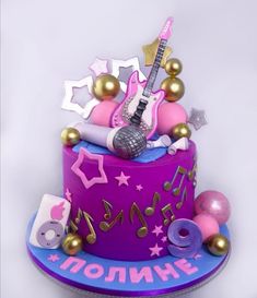 a birthday cake decorated with musical instruments and stars