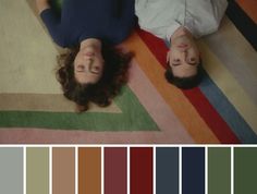 two people laying on the floor with their eyes closed