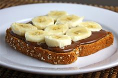 a piece of bread with chocolate and bananas on it