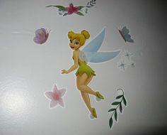 the tinkerbell fairy wall decals are on display
