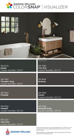 the color scheme for this bathroom is dark gray and has white fixtures, including a bathtub