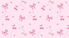 a pink wallpaper with cherries and bow ties on it's back ground