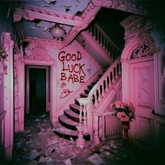 an old house with graffiti on the walls and stairs