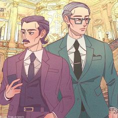 two men in suits standing next to each other