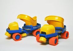 two plastic toy trucks with yellow and blue wheels