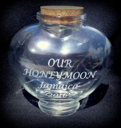 a clear glass jar with a corked top that says our honeymoon moon jamaci 2010