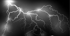 a black and white photo of lightning in the night sky with bright lights above it