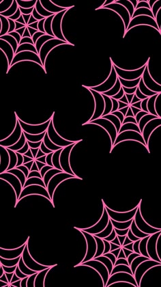 a black background with pink spider webs on it