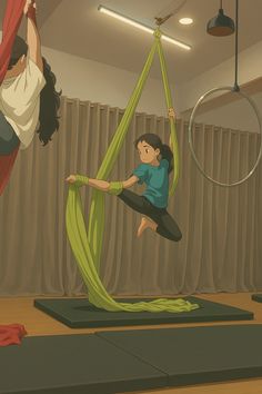 two women doing aerial yoga exercises in a room