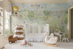 a baby's room with a crib, rocking horse and toy animals on the floor