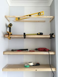 some shelves with tools on them in a room