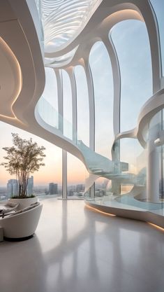 the interior of a modern building with large windows and curved staircase leading up to it