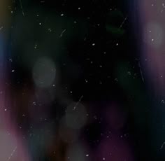 blurry image of rain falling down on the window