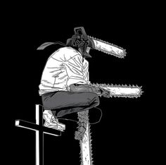 a man riding a snowboard on top of a metal pole with chains attached to it