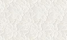 an image of white lace with flowers on it