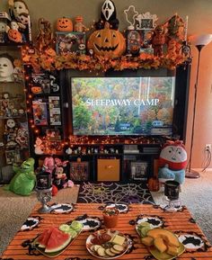 a living room filled with halloween decorations and food