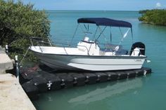a boat is docked in the water near a dock