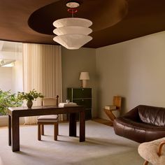 a living room filled with furniture and a large window