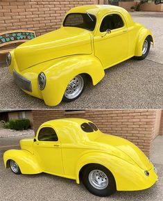 an old yellow car is parked in front of a brick wall and side by side