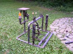 an old pipe structure is sitting in the grass