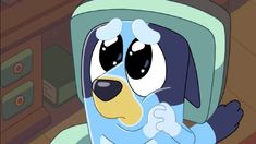 a cartoon dog sitting in front of a computer monitor