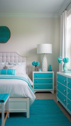 a bed room with a neatly made bed and dressers