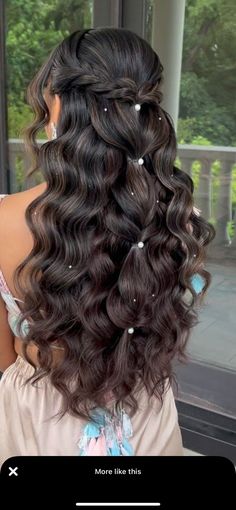 the back of a woman's head with long curly hair and curls on it