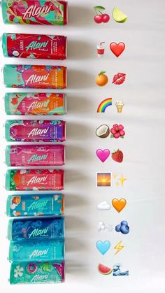 several different types of toothpaste are lined up on a white surface with hearts and rainbows