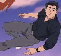 a man flying through the air while wearing a black shirt and gray pants with his hands out in front of him