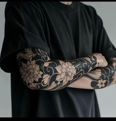 a man with tattoos on his arm and arms
