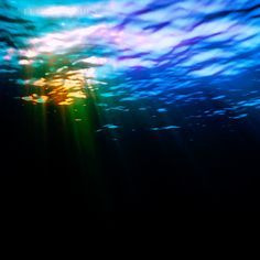 the sun is shining brightly through the water